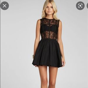 Mini Crewneck, sleeveless, sheer bodice with sweetheart bra. Pleated Skirt